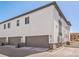 Exterior showing garage of a new construction home, with well-maintained landscaping and modern design at 19197 E 64Th Ave, Denver, CO 80249