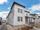 Contemporary home exterior highlighting clean lines, neutral tones, and landscaped surroundings at 19197 E 64Th Ave, Denver, CO 80249