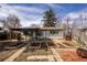 Charming backyard featuring garden beds, patio, pergola and solar panels at 780 Campo St, Denver, CO 80221