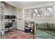 Cozy bedroom featuring a work-space with a large window offering natural light and a comfortable bed at 780 Campo St, Denver, CO 80221