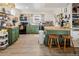 Charming kitchen featuring green cabinetry, butcher block countertops and stainless steel appliances at 780 Campo St, Denver, CO 80221