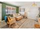 Bright living room with a comfortable sofa, patterned rug, and charming decor at 780 Campo St, Denver, CO 80221