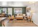 Comfortable living area featuring a cozy couch, warm lighting, and inviting decor at 780 Campo St, Denver, CO 80221