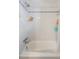 Bright white tiled shower featuring classic fixtures, providing a clean and functional space at 780 Campo St, Denver, CO 80221