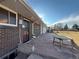 Brick home featuring a stone patio and well maintained backyard at 2357 E Mineral Ave, Centennial, CO 80122