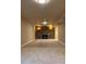 Large finished basement featuring carpet and a stone fireplace with sconces and an electric fire at 2357 E Mineral Ave, Centennial, CO 80122