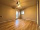 Bedroom featuring hardwood floors, neutral paint, ceiling fan and glass patio door at 2357 E Mineral Ave, Centennial, CO 80122