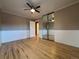 Bedroom features hardwood floors, and mirrored closet at 2357 E Mineral Ave, Centennial, CO 80122