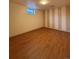 Bedroom with light walls, hardwood floor, and a window at 2357 E Mineral Ave, Centennial, CO 80122