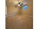 Bedroom with neutral carpet, ceiling fan, and window, and a doorway to another room at 2357 E Mineral Ave, Centennial, CO 80122