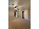 Neutral bedroom with ceiling fan, closet, and view to stairs at 2357 E Mineral Ave, Centennial, CO 80122