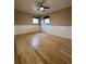 This bedroom offers hardwood floors and bright windows at 2357 E Mineral Ave, Centennial, CO 80122