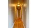This hallway features hardwood floors and neutral paint at 2357 E Mineral Ave, Centennial, CO 80122