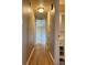 Hallway with hardwood floors leads to a bathroom with a granite sink at 2357 E Mineral Ave, Centennial, CO 80122