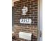 Close up of house number with outdoor lantern, mailbox, and door at 2357 E Mineral Ave, Centennial, CO 80122