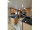 Well-lit kitchen featuring granite countertops, and stainless steel appliances at 2357 E Mineral Ave, Centennial, CO 80122