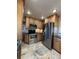 This kitchen features stainless steel appliances, granite countertops, and updated cabinets at 2357 E Mineral Ave, Centennial, CO 80122