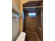 Close-up of the dark tiled shower with built-in seat at 2357 E Mineral Ave, Centennial, CO 80122