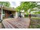 Outdoor patio features an open deck with grill, sitting area and a fenced yard providing ample privacy at 3111 Troy St, Aurora, CO 80011