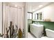 Charming bathroom featuring a vanity with stylish mirror and a shower with a cactus-themed curtain at 3111 Troy St, Aurora, CO 80011