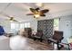 Bright bonus room featuring a ceiling fan, natural light, and play area at 3111 Troy St, Aurora, CO 80011