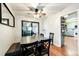View of dining room featuring a table with four chairs, bench and access to the kitchen at 3111 Troy St, Aurora, CO 80011