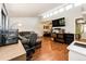 Spacious living room featuring hardwood floors and large window at 3111 Troy St, Aurora, CO 80011