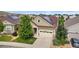 Aerial view of a home in a residential neighborhood, showcasing the roof, yard, and surrounding houses at 6046 Gilbert Way, Golden, CO 80403