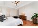 Bedroom with tray ceiling, neutral paint color, hardwood floors and walk in closet at 6046 Gilbert Way, Golden, CO 80403