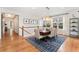 Elegant dining room featuring hardwood floors, a stylish light fixture, and a view of the staircase at 6046 Gilbert Way, Golden, CO 80403