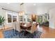 Spacious dining area with a large wooden table, comfortable chairs, and plenty of natural light at 6046 Gilbert Way, Golden, CO 80403