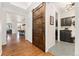 Entryway with hardwood floors, barn door, and access to the kitchen and laundry room at 6046 Gilbert Way, Golden, CO 80403