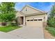 Charming two-story home with a two-car garage, stone accents, and well-maintained landscaping at 6046 Gilbert Way, Golden, CO 80403