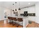 Stylish kitchen boasts a large island with granite countertops, pendant lighting, and ample cabinet space at 6046 Gilbert Way, Golden, CO 80403