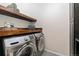 Laundry room has side by side washer and dryer with above storage at 6046 Gilbert Way, Golden, CO 80403