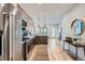 Open-concept kitchen with stainless steel appliances, modern countertops, and view into the living space at 1715 Grove St, Denver, CO 80204