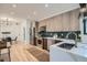 Modern kitchen featuring stainless steel appliances, sleek countertops, and hardwood floors at 1715 Grove St, Denver, CO 80204