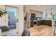 Modern kitchen featuring stainless steel appliances, designer backsplash, and wood cabinets at 1715 Grove St, Denver, CO 80204