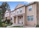 Inviting two-story townhouse featuring a covered entryway, well-maintained lawn, and a cozy, welcoming facade at 12131 Bannock St # C, Westminster, CO 80234