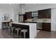 Modern kitchen with stainless steel appliances, island seating, and ample counter space at 2536 W 33Rd Ave, Denver, CO 80211