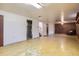 Spacious basement with stairs and a utility closet at 1750 S Dale Ct, Denver, CO 80219