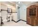 Well-lit bathroom featuring a pedestal sink, a glass-enclosed shower, and unique antique cabinet at 1750 S Dale Ct, Denver, CO 80219