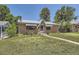 Charming brick home with a well-maintained front yard and awning at 1750 S Dale Ct, Denver, CO 80219