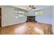 Bright living room with hardwood floors and a stone fireplace at 1750 S Dale Ct, Denver, CO 80219