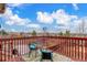 Back deck features railing, outdoor furniture, and views of the neighborhood at 6193 Brantly Ave, Castle Rock, CO 80104