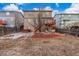 Backyard featuring a mulched seating area and a hot tub at 6193 Brantly Ave, Castle Rock, CO 80104