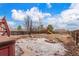 Backyard featuring a playground and a fire pit area at 6193 Brantly Ave, Castle Rock, CO 80104