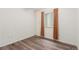 Small bedroom features vinyl floors, small window, and closet at 6193 Brantly Ave, Castle Rock, CO 80104