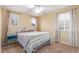 A cozy bedroom with a ceiling fan, neutral paint, and natural light from two windows at 6193 Brantly Ave, Castle Rock, CO 80104