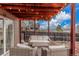 A covered patio with outdoor furniture and string lights at 6193 Brantly Ave, Castle Rock, CO 80104